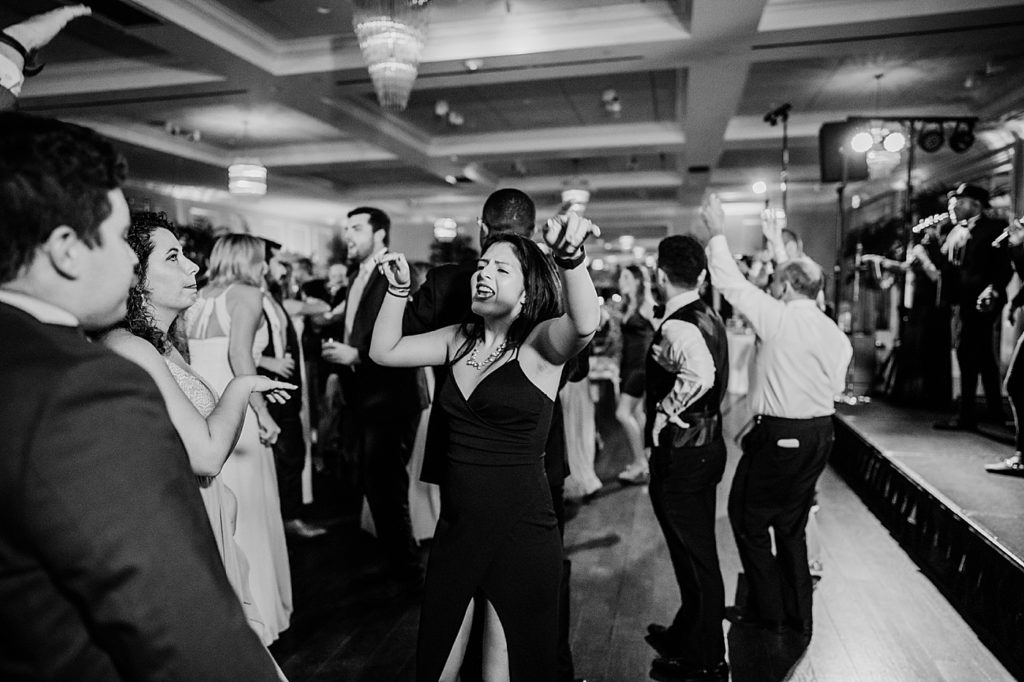 B&W candid dancing at Reception Pelican Club Wedding Photography captured by South Florida Wedding Photographer Krystal Capone Photography