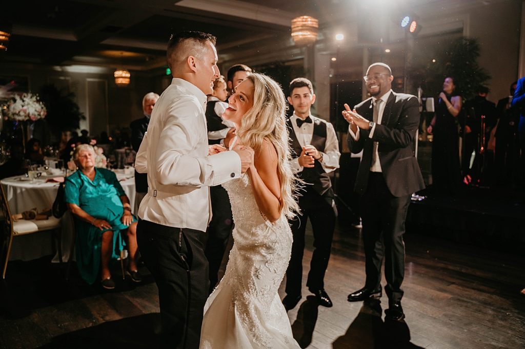 Bride and Groom dancing together at Reception Pelican Club Wedding Photography captured by South Florida Wedding Photographer Krystal Capone Photography