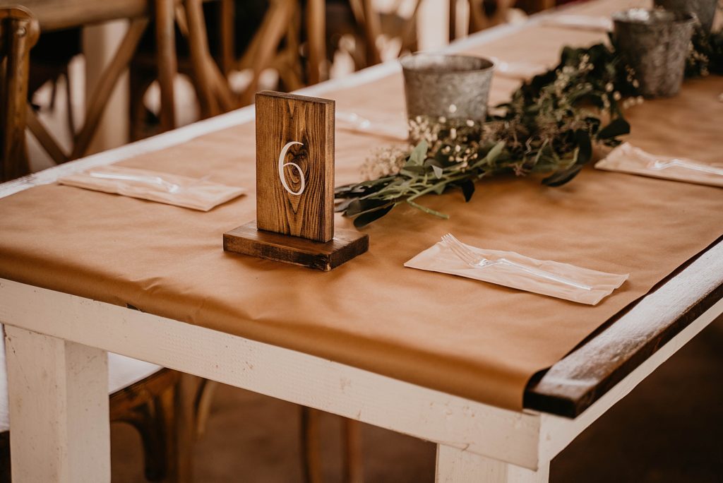 Detail shot of Reception table with table number The Lake House Fort Pierce Wedding Photography captured by South Florida Wedding Photographer Krystal Capone Photography 