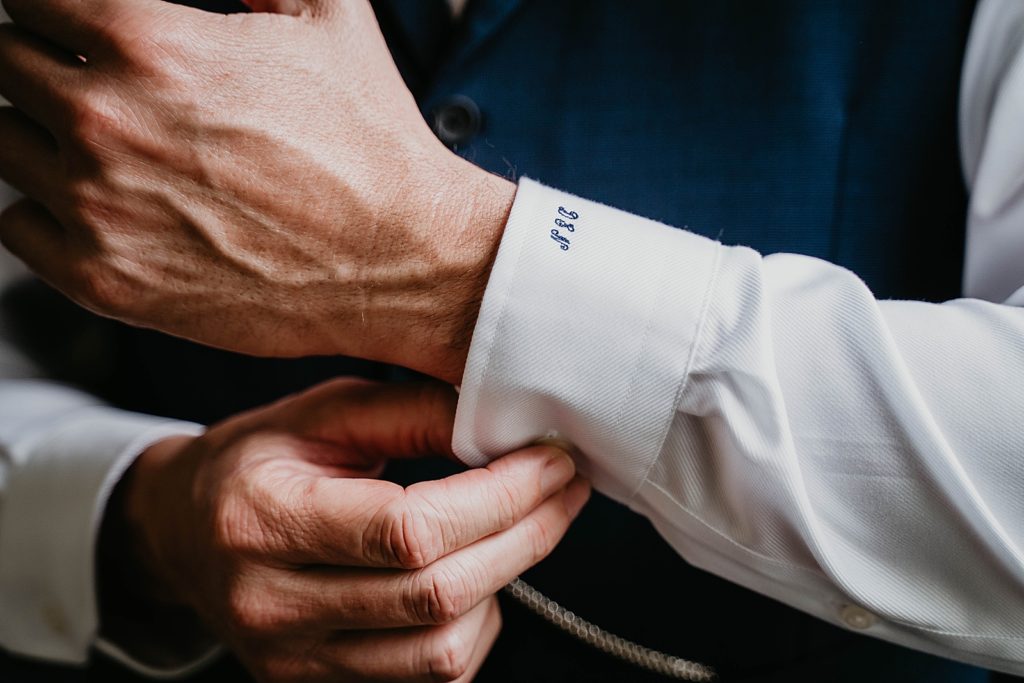 Closeup of Groom adjusting cuff Getting ready The Lake House Fort Pierce Wedding Photography captured by South Florida Wedding Photographer Krystal Capone Photography 