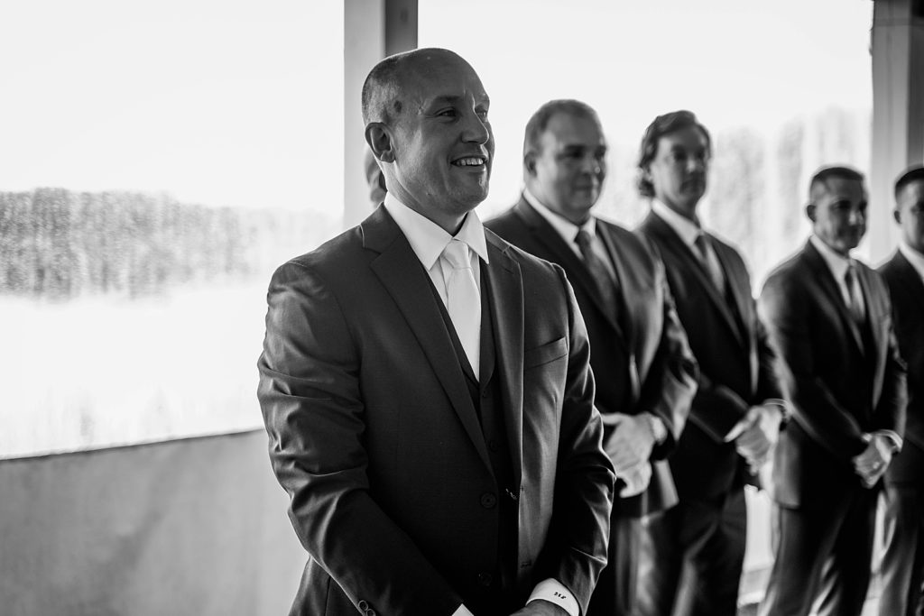 B&W of Groom awaiting Bride with Groomsmen The Lake House Fort Pierce Wedding Photography captured by South Florida Wedding Photographer Krystal Capone Photography 