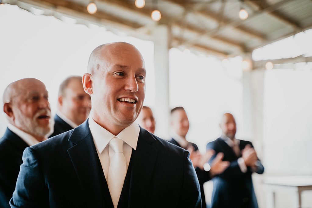 Groom's reaction to seeing Bride emntering Ceremony The Lake House Fort Pierce Wedding Photography captured by South Florida Wedding Photographer Krystal Capone Photography 