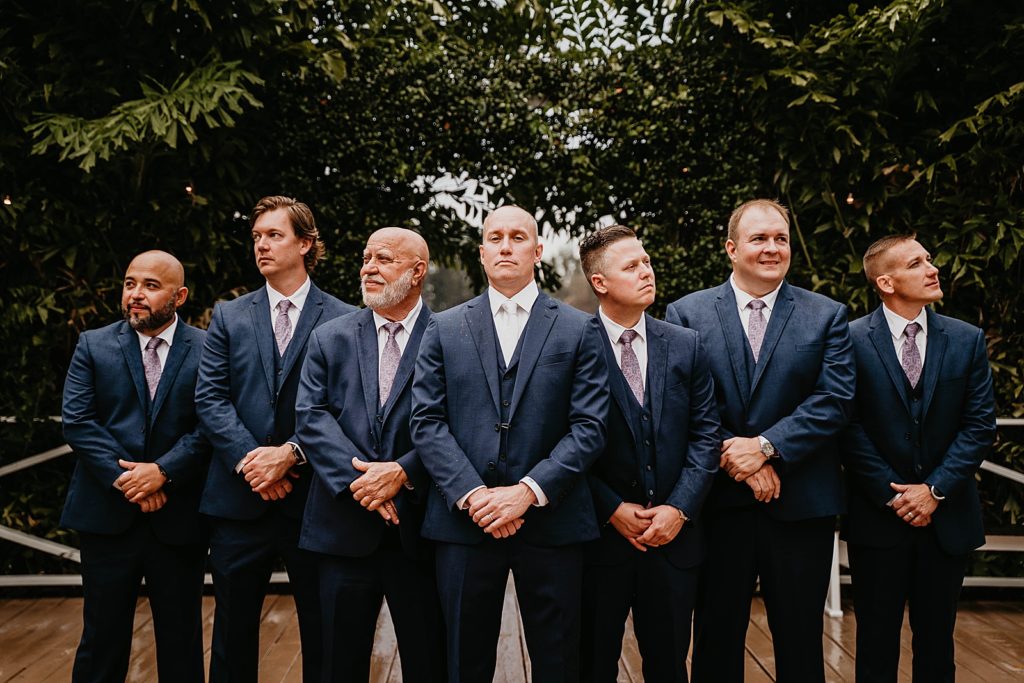 Groom standing formally with Groomsmen The Lake House Fort Pierce Wedding Photography captured by South Florida Wedding Photographer Krystal Capone Photography 