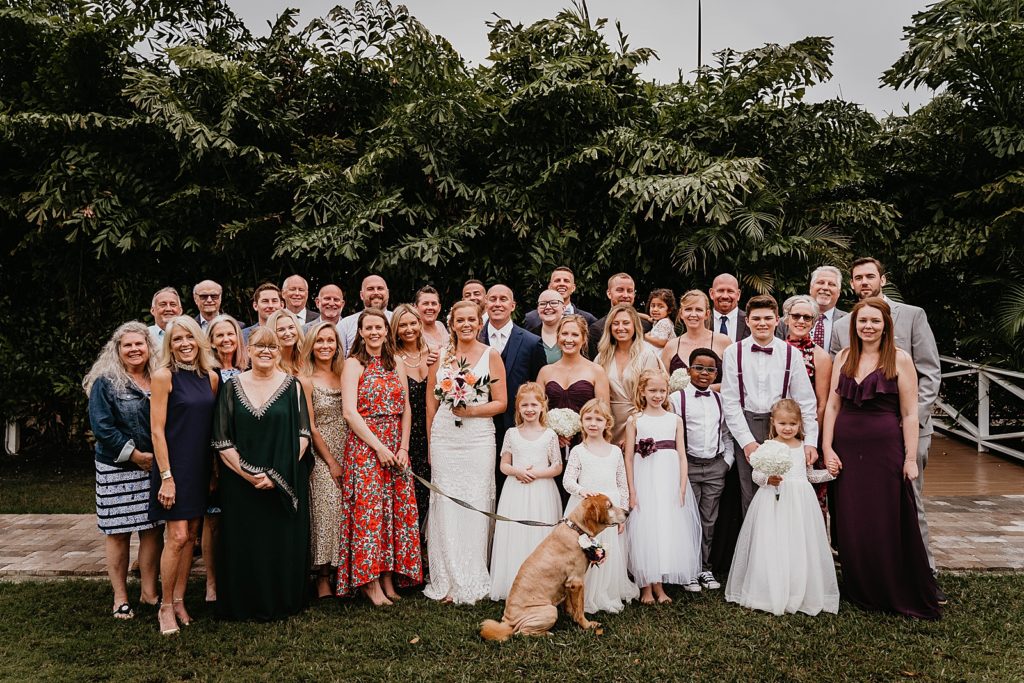 Bride and Groom portrait with whole family and dog The Lake House Fort Pierce Wedding Photography captured by South Florida Wedding Photographer Krystal Capone Photography 