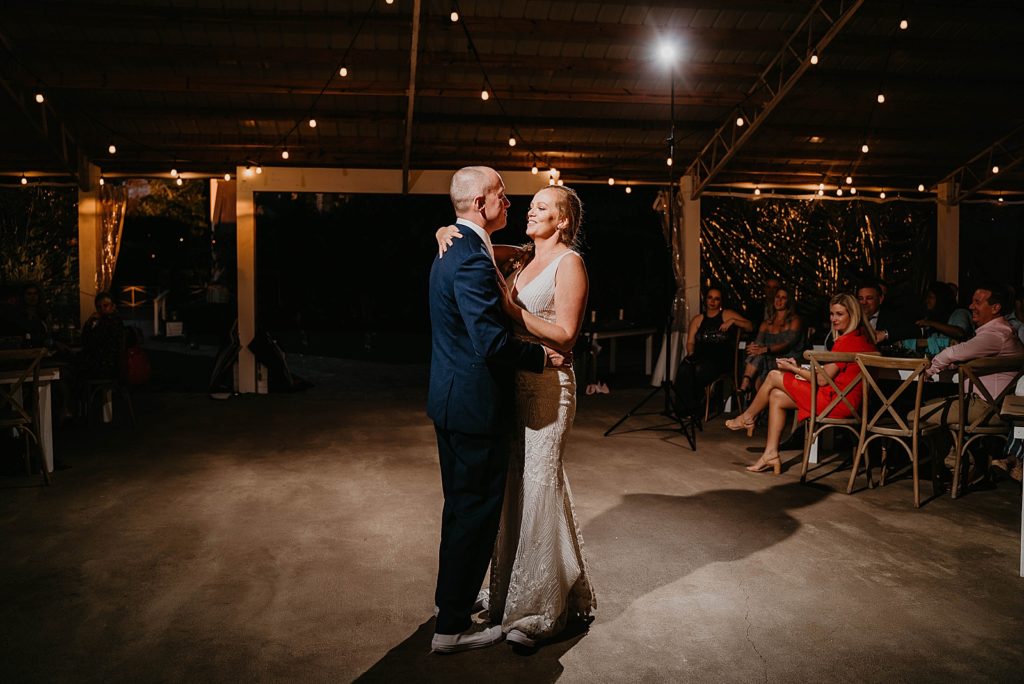 Bride and Groom dancing for nighttime first dance The Lake House Fort Pierce Wedding Photography captured by South Florida Wedding Photographer Krystal Capone Photography 