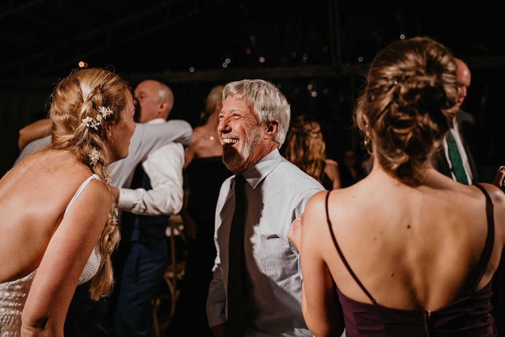 Bride having fun dancing with guests at Reception The Lake House Fort Pierce Wedding Photography captured by South Florida Wedding Photographer Krystal Capone Photography 