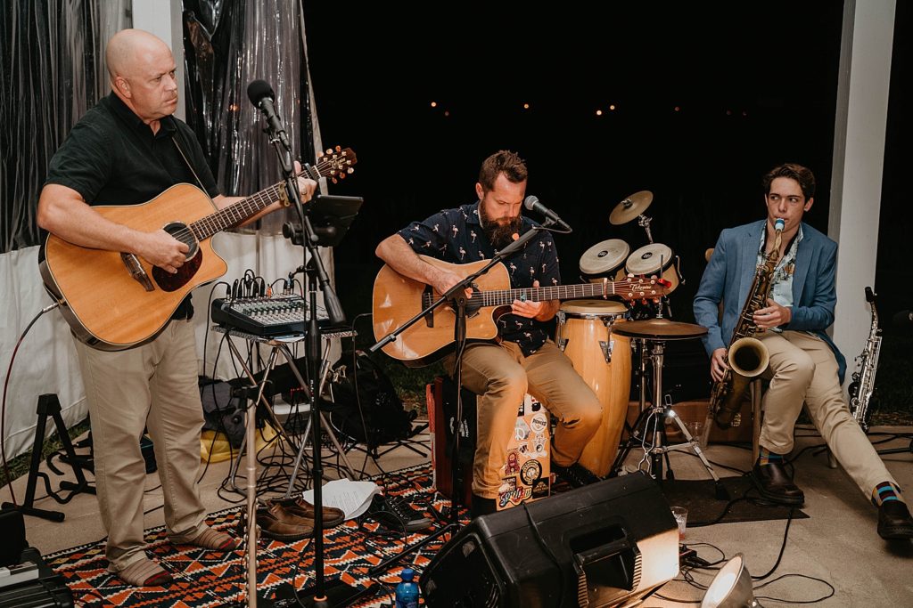 Live band performance two guitarists and saxophone players The Lake House Fort Pierce Wedding Photography captured by South Florida Wedding Photographer Krystal Capone Photography 