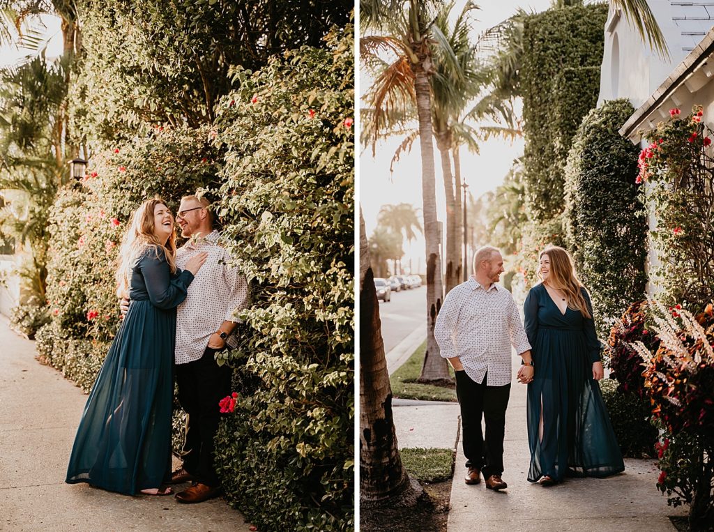 Couple holding each other and each others hands smiling with the sun shining on greenery and palm trees Worth Ave Palm Beach Engagement Photography captured by South Florida Engagement Photographer Krystal Capone Photography