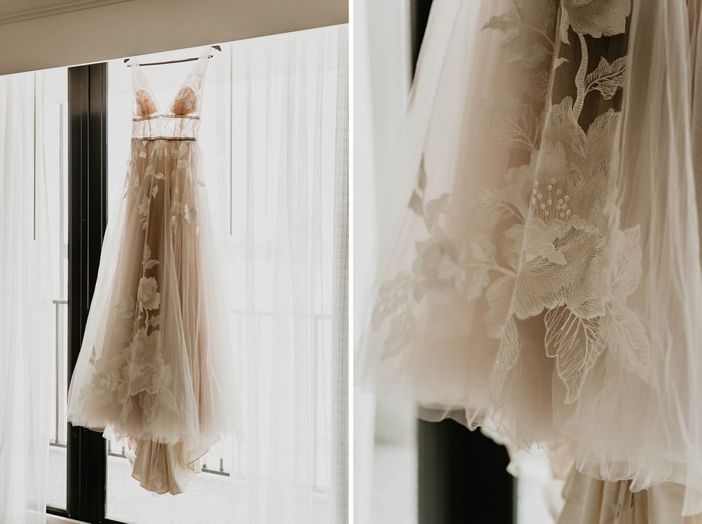 Detail shot of Wedding dress hanging by window