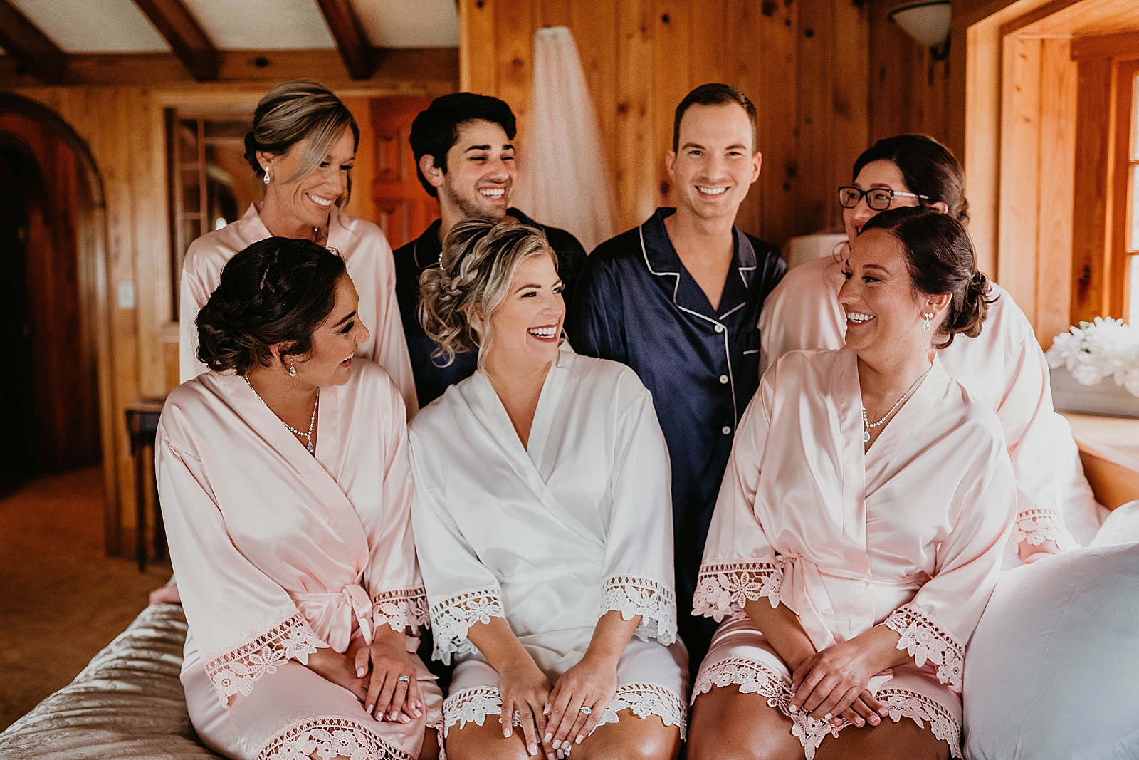 Bride and Bridesmaids together in robes before getting ready