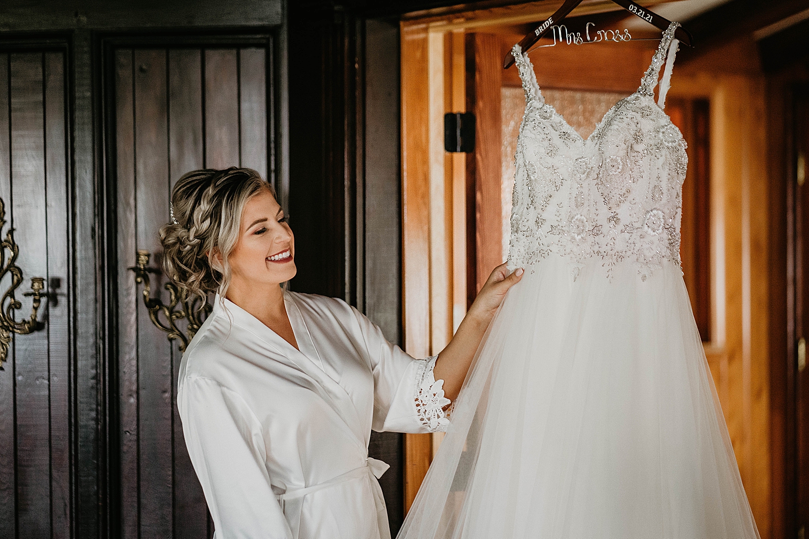 Bride looking at her wedding dress before Getting Ready