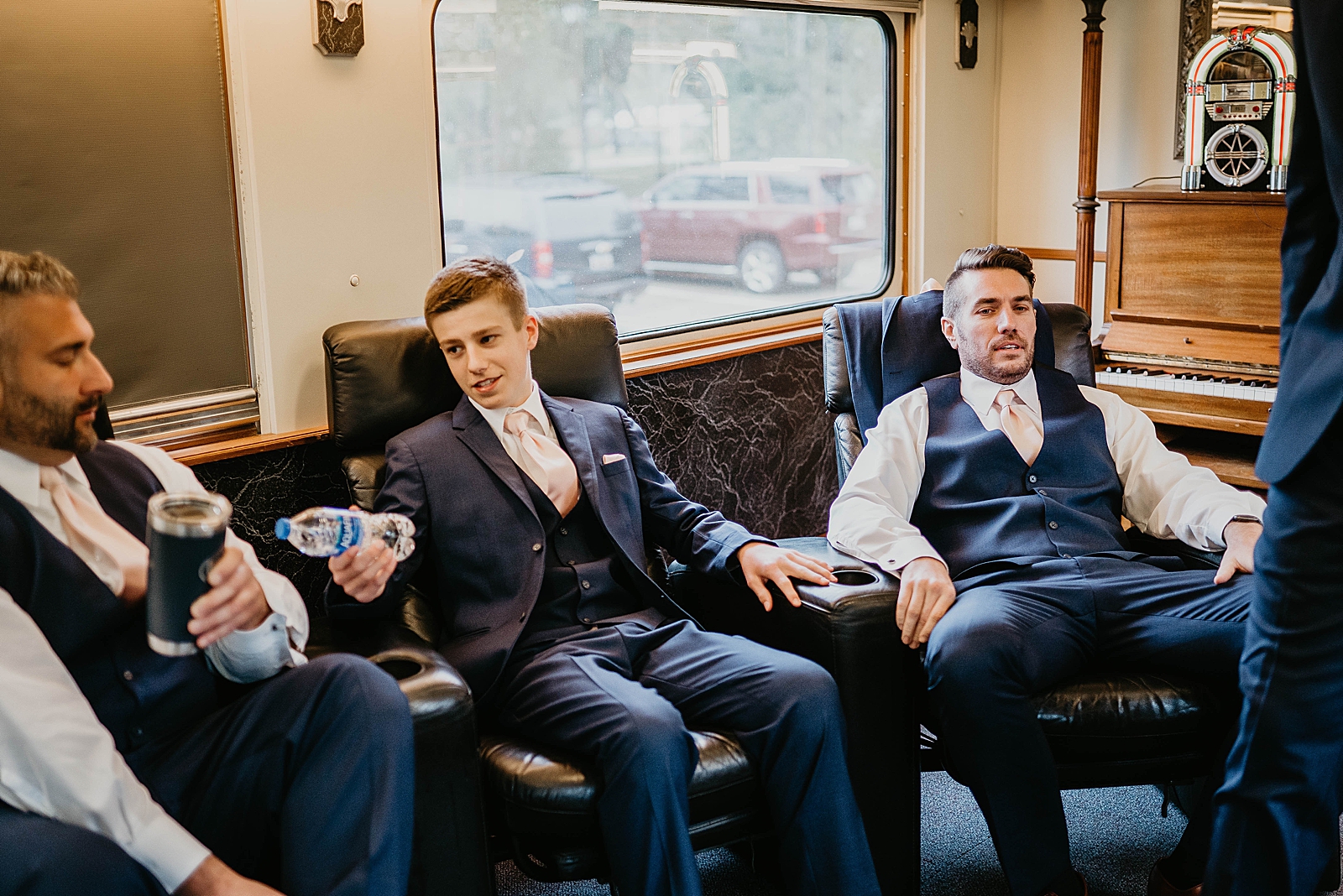 Groomsmen and wedding party chilling and relaxing before ceremony
