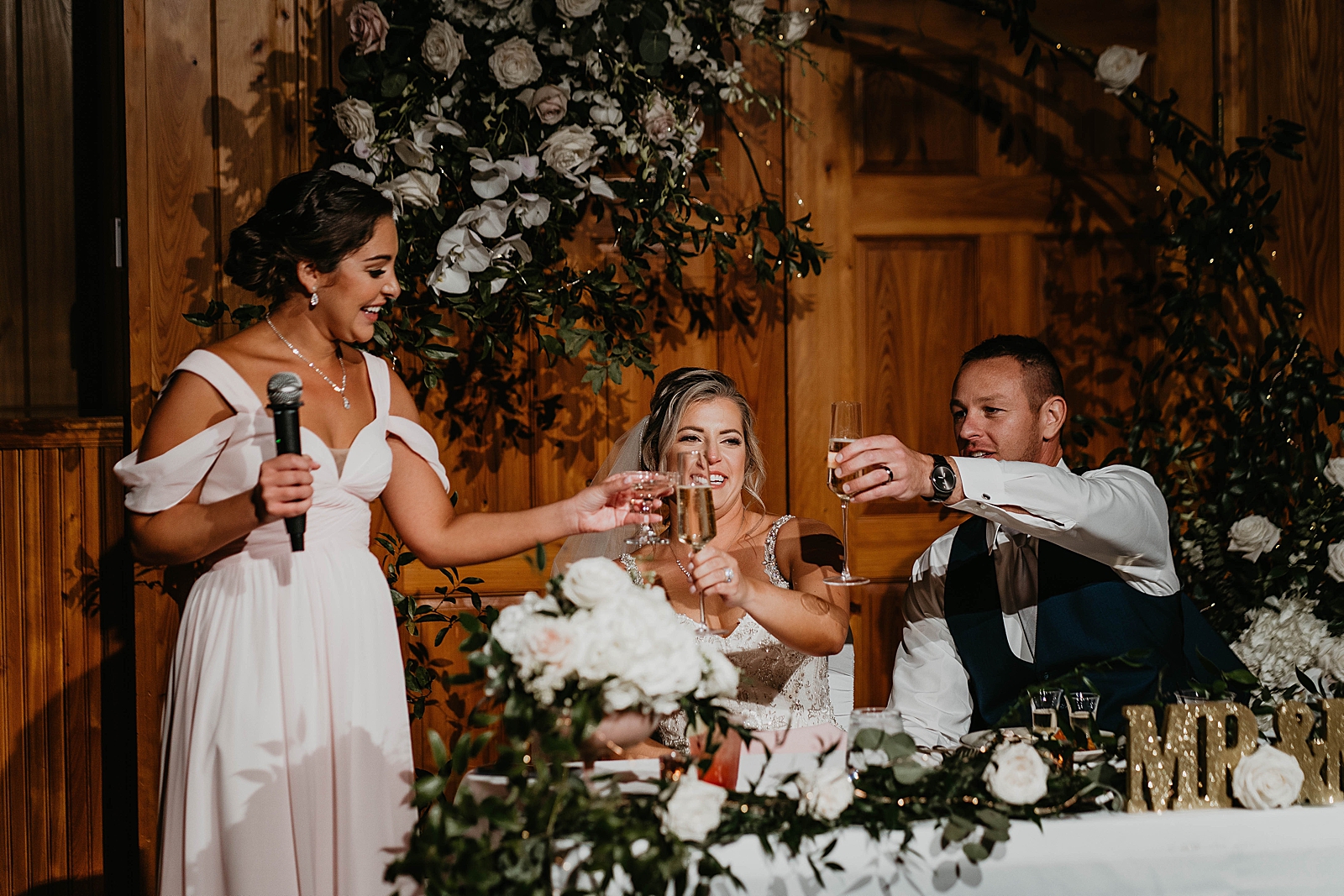 Maid of Honor toast by sweetheart table at Reception