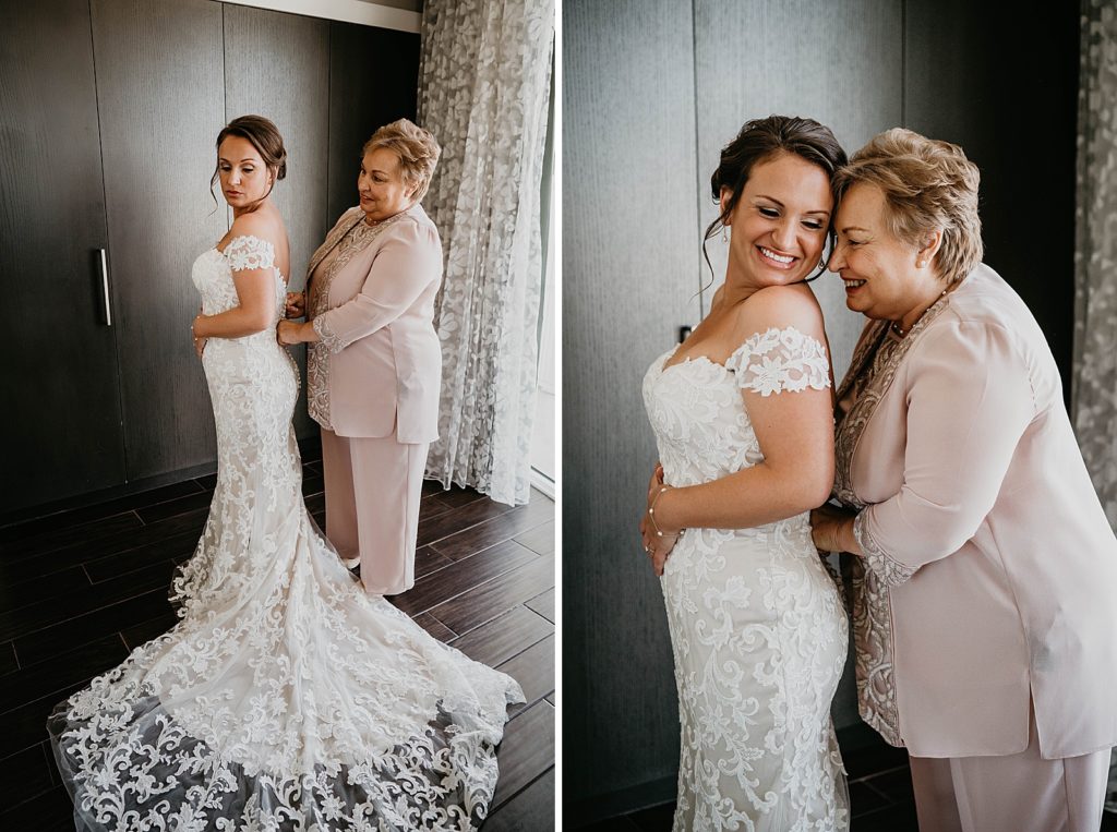 Mother helping Bride get dress on Getting Ready
