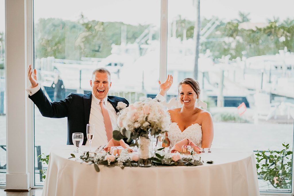 Bride and Groom fun reaction at sweetheart table
