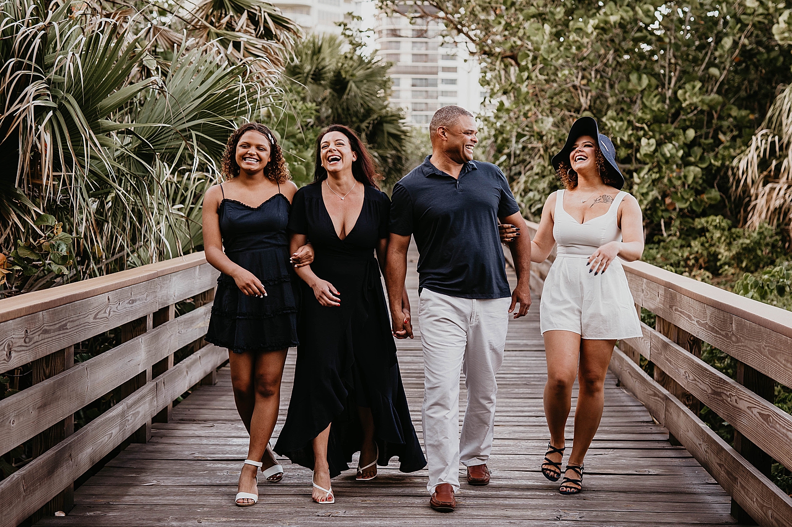 Family laughing together on the bridge