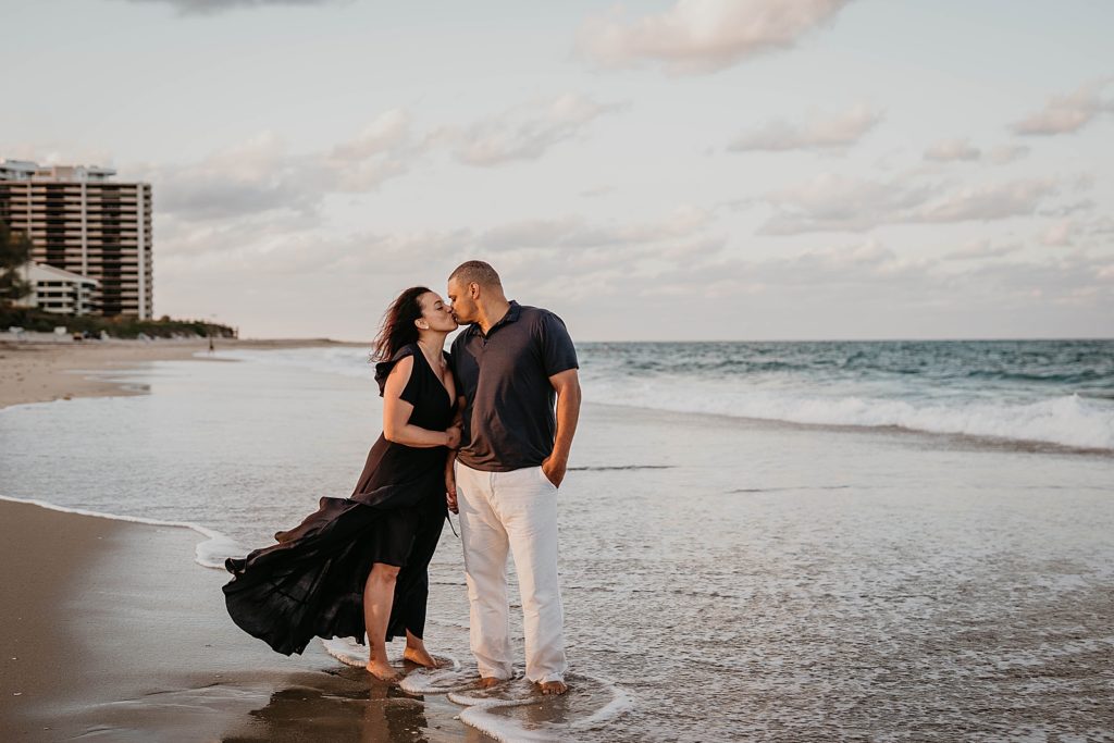 Husband and wife kissing on the beach