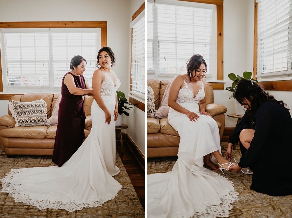 Mother helping Bride with dress and shoes