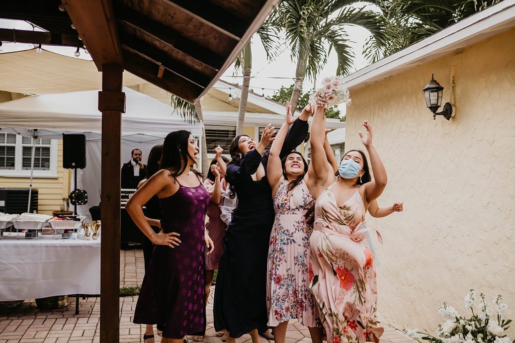 Single ladies trying to catch bouquet