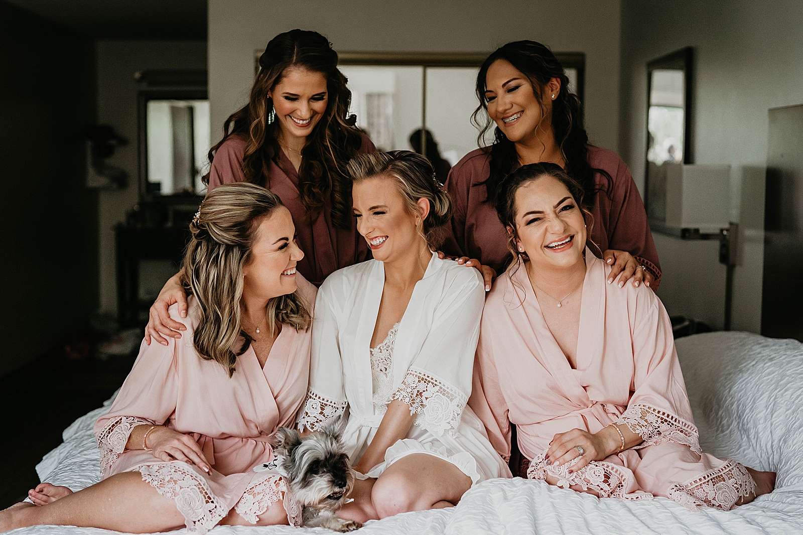 Bride with Bridesmaids before getting ready with dog