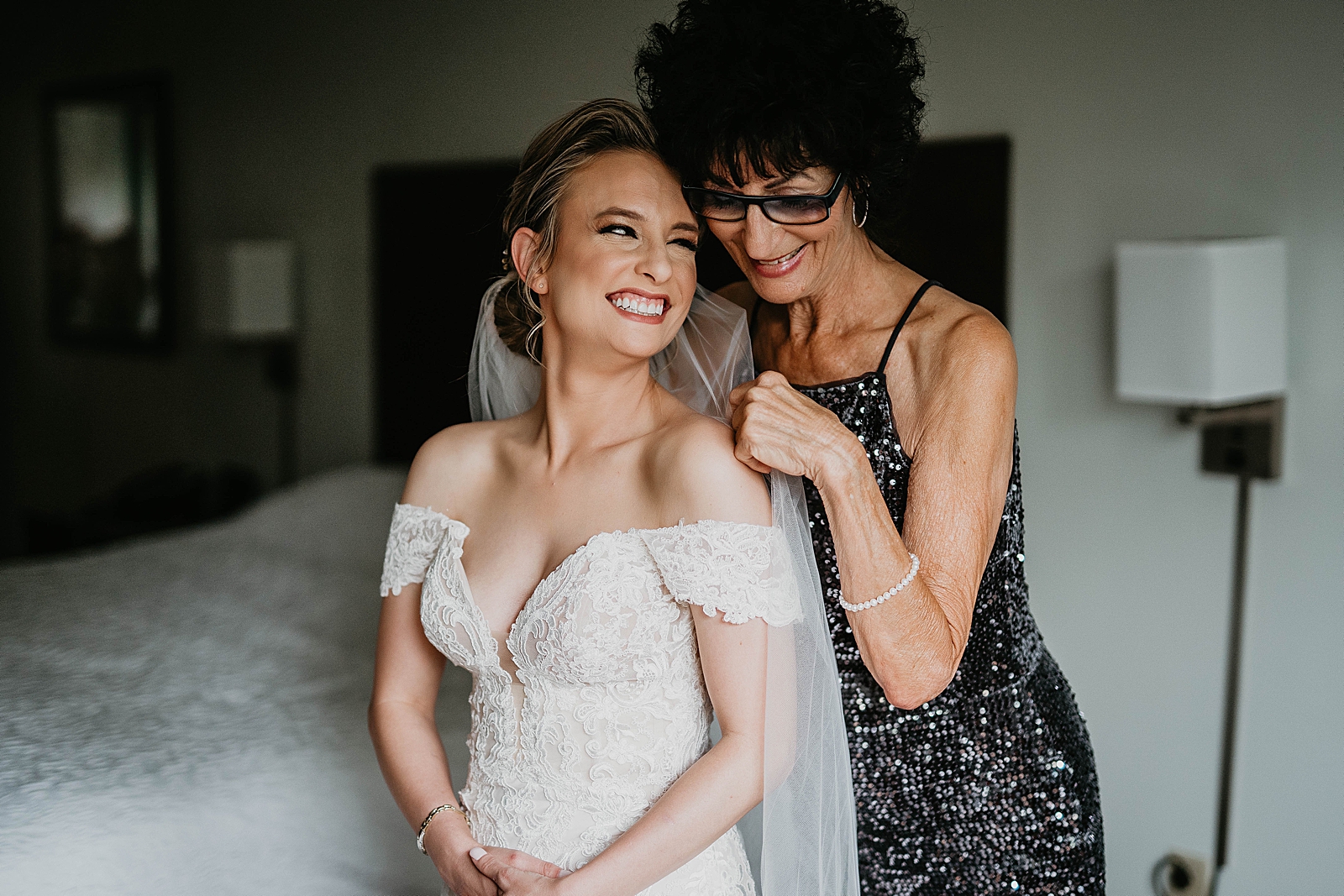 Bride and Mother smiling after getting ready