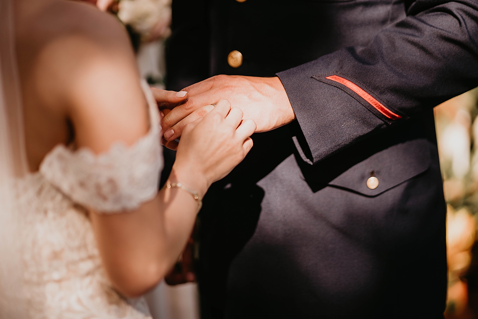 Closeup of Bride and Groom holding hands during Ceremony