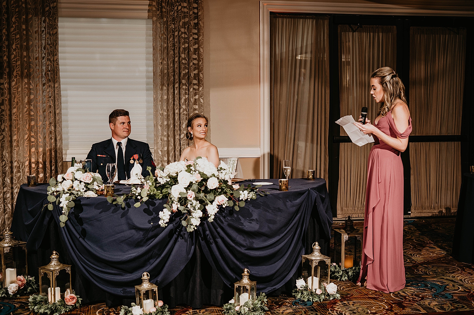 Bride and Groom listening to Maid of Honor Speech at sweetheart table